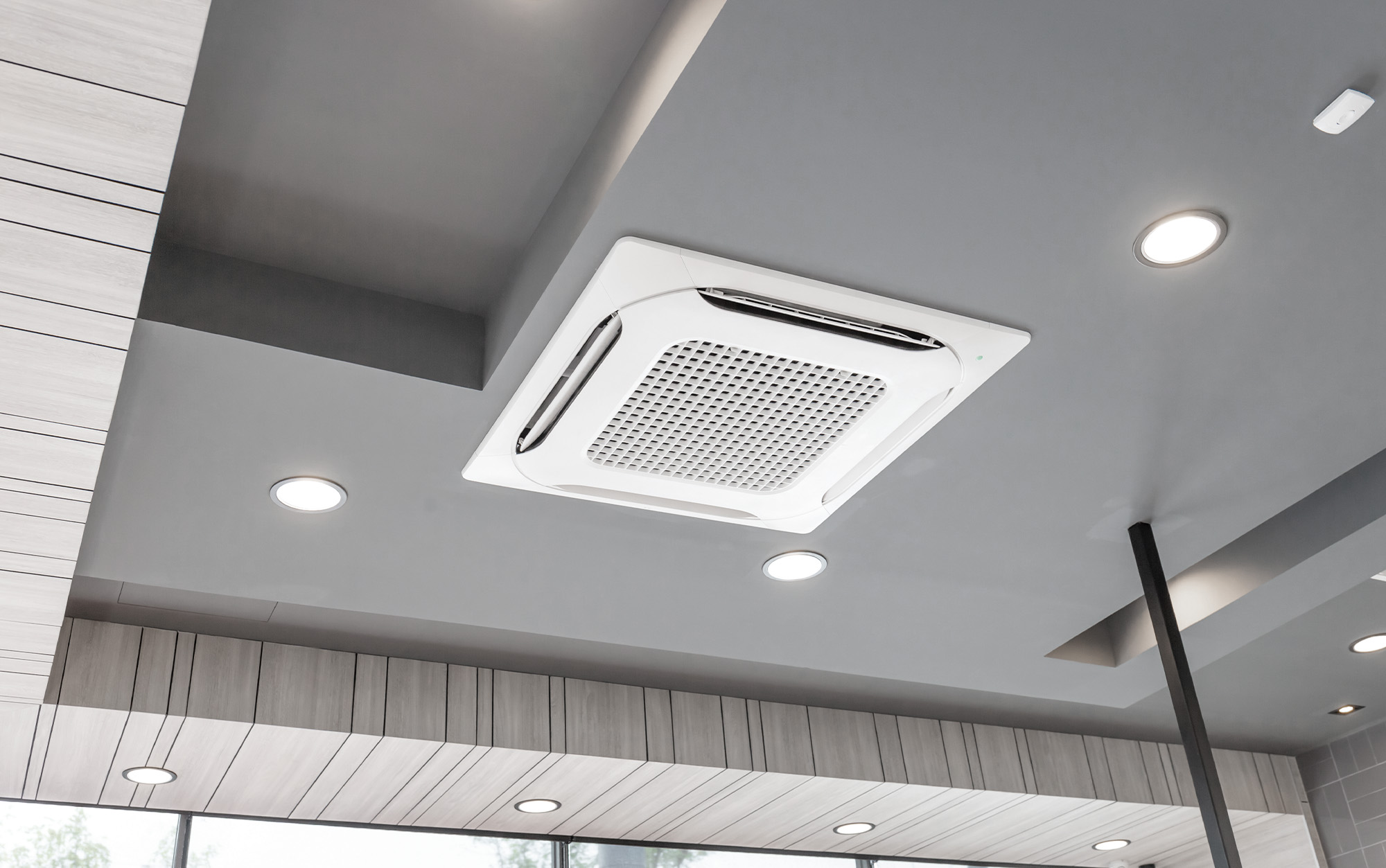 Woman Inspecting Air Conditioner